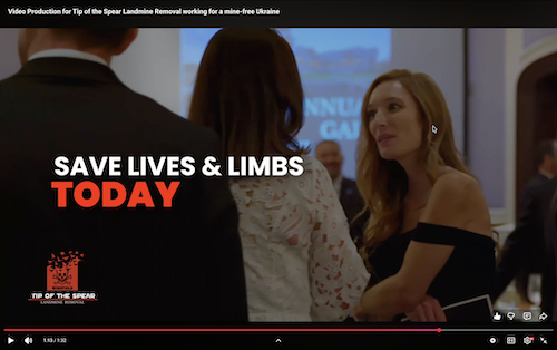 Woman at elegant event interacting with guests, overlaid with motivational 'SAVE LIVES & LIMBS TODAY' text – impactful fundraising video production nonprofits footage from Tip of the Spear Landmine Removal's humanitarian gala